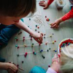 kids making geometric shapes from sticks and play dough
